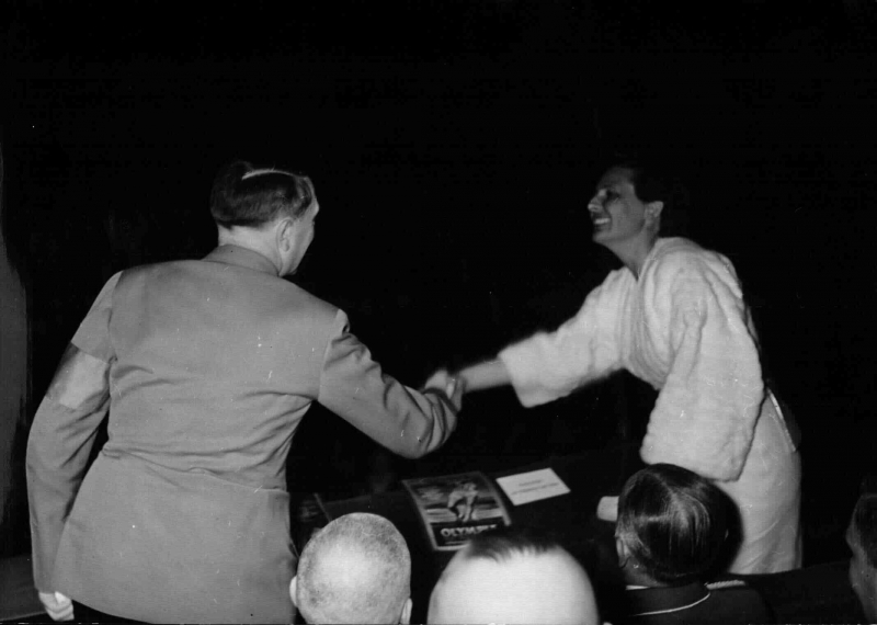 Adolf Hitler shaking hands with German actress and director Leni Riefenstahl at the premier of the film Olympia